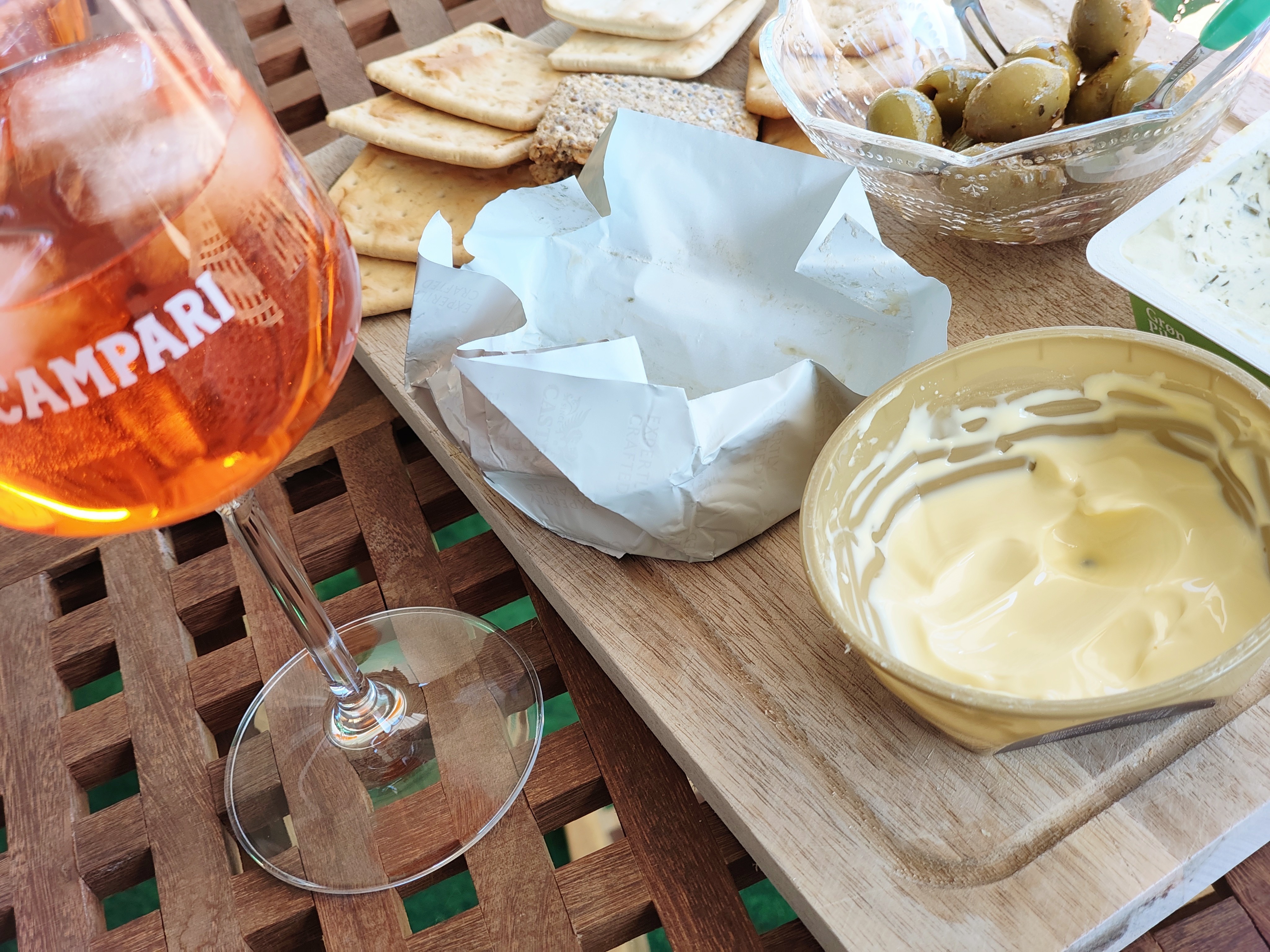 New life, new small pleasures: Friday's aperitivo in our sunroom with Aperol Tonic, cheese, olives, and crackers.
