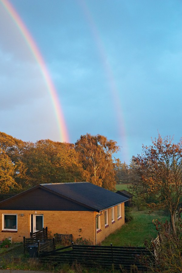 We've had terrible weather today. But for a very brief moment, we were treated to the most amazing full double rainbow. I had just enough time to capture a handful of hasty snapshots before the rainbow dissolved into grayness.